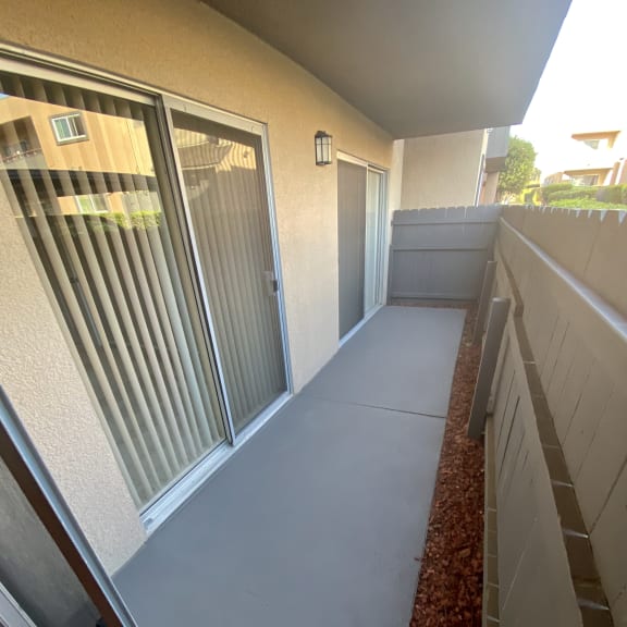 a walkway leading up to the doors of a condo