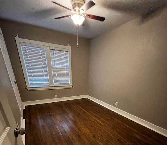 Bedroom with hard wood floors