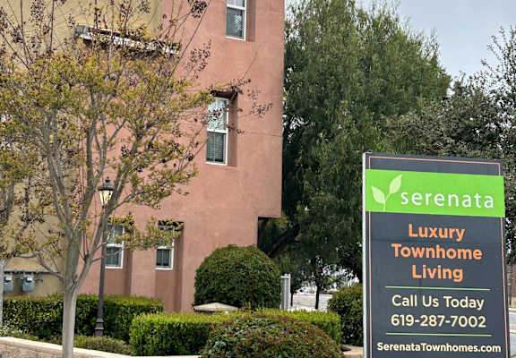 a building in serenata with a sign in front of it