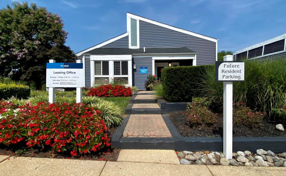 a blue house with two signs in front of it at ReNew Odenton, Odenton, MD, 21113