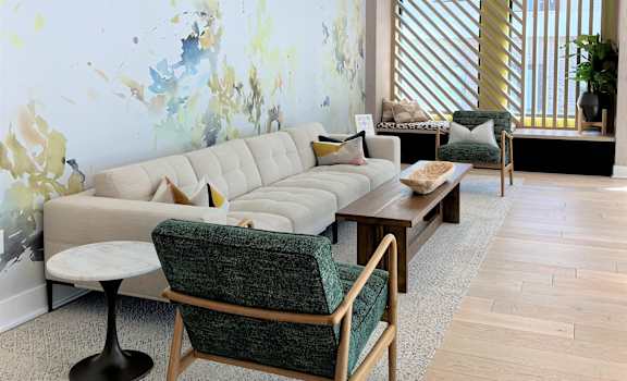 Common area seating with window seat at The Maven, Suwanee