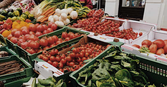 a fruit and vegetable stand at a market