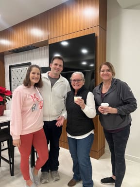 a group of people posing for a photo in a living room