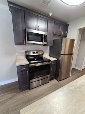 Rehabbed kitchen with stainless steel appliances