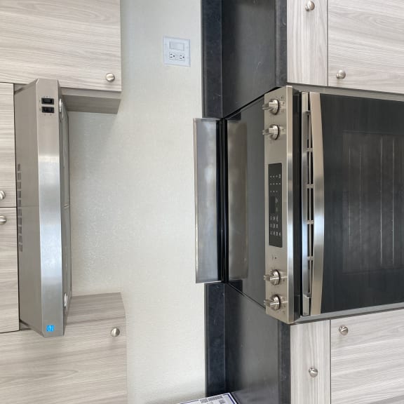 a stainless steel microwave oven in a kitchen