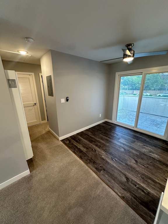 a room with a door open to a bathroom and a closet