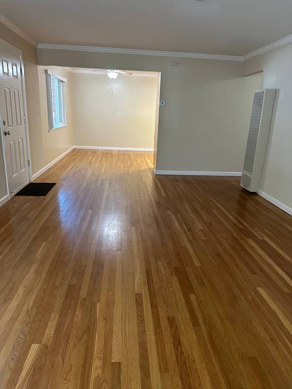 a room with a door open to a bathroom and a closet