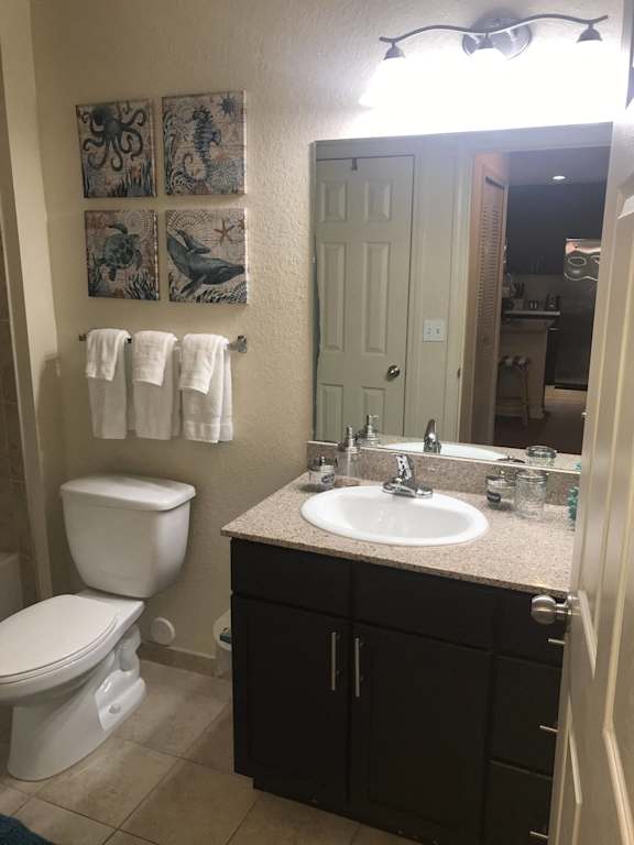 a bathroom wi at The Dakota Apartments, Florida 33458th a sink toilet and a mirror
