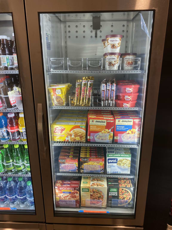 a refrigerator full of snacks and drinks