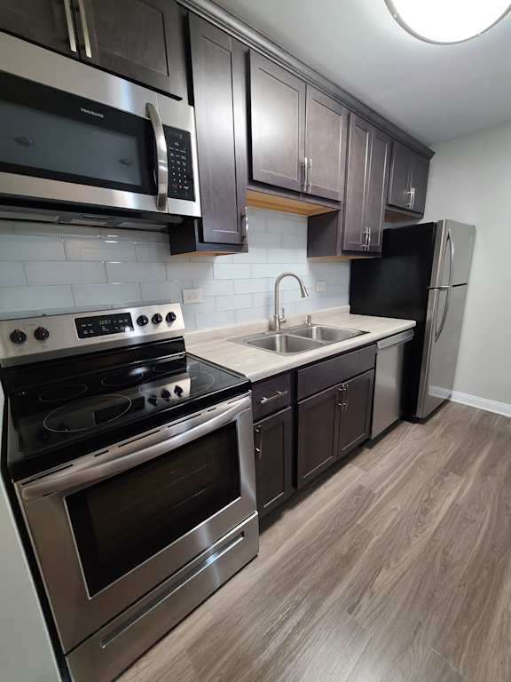 Glass backsplash and stainless steel appliances