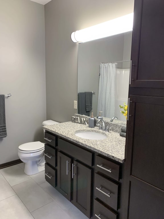 Master bathroom with granite counters and abundant storage in a Harper two bedroom floor plan apartment at North Point Villas in Lincoln Ne