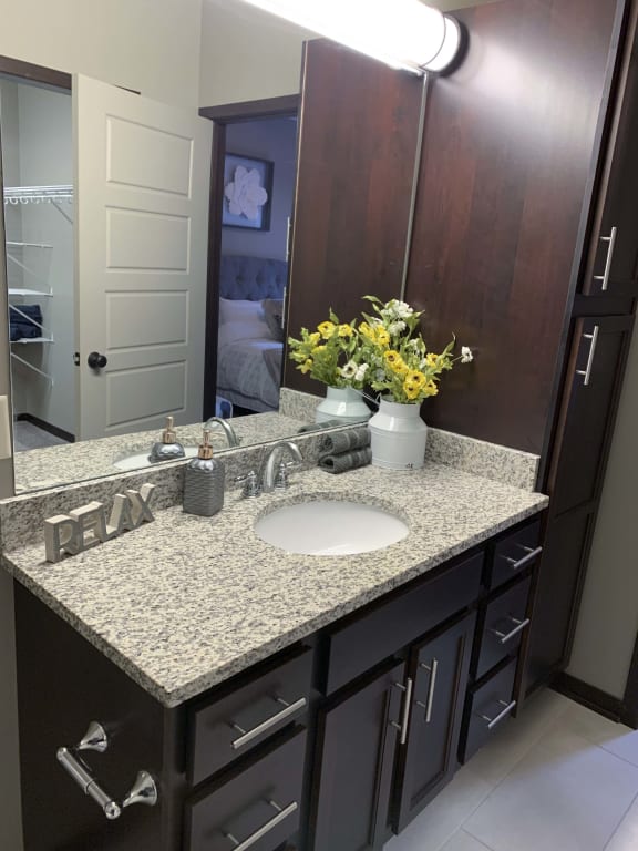 Bathroom with tall cabinets attached to the vanity at North Pointe villas