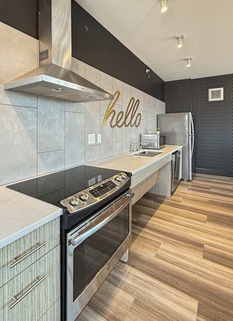 A kitchen with wooden cabinets and white appliances.