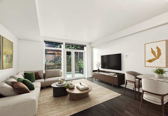 a living room with a couch and a table and a television