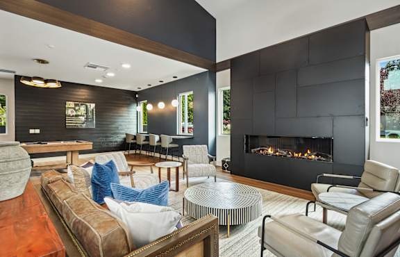 A modern living room with a fireplace and a couch.