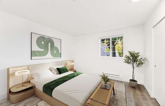A bedroom with a large bed and a green abstract painting above it.