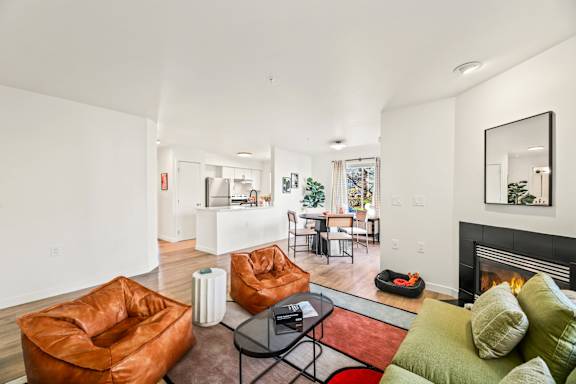 A living room with a fireplace and a couch.