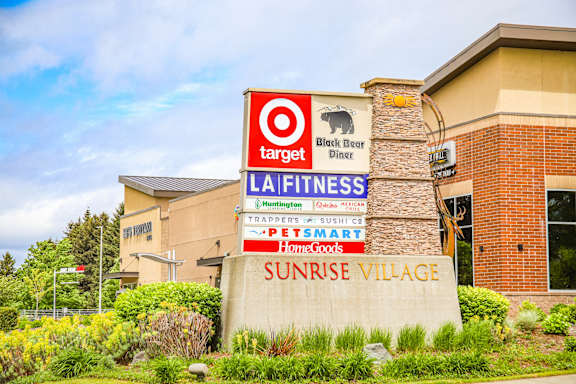 the outside of a target store with signs in front of it