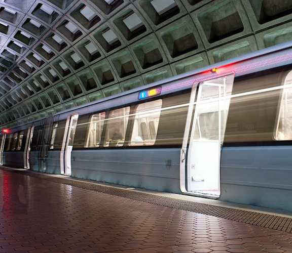 a train at a station with its doors open at Parkland Village, Forestville, MD 20747