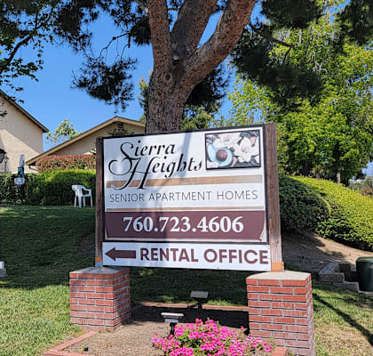a sign in front of a house
