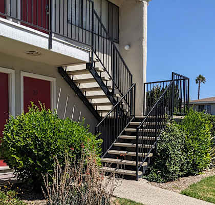 a house with a staircase in front of it