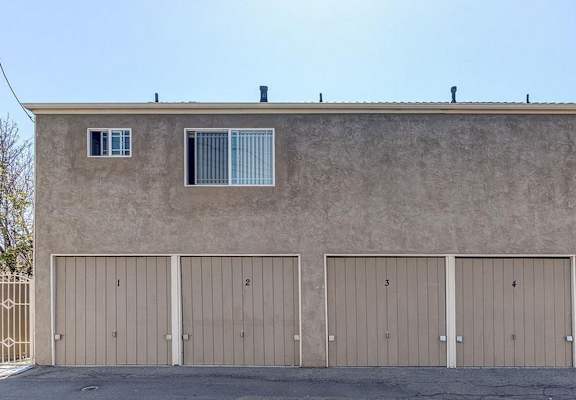 a garage with a closed door and a window