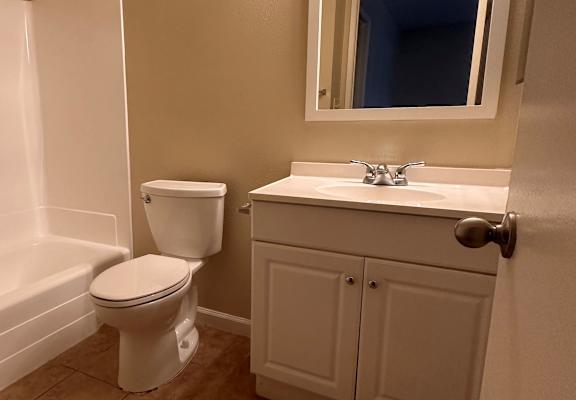 a bathroom with a toilet sink and bathtub