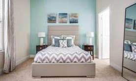 comfortable bedroom at Greenway at Stadium Park Apartments in Greensboro