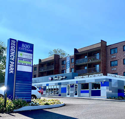 a large building with a parking lot in front of it