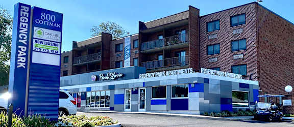 a large building with a parking lot in front of it