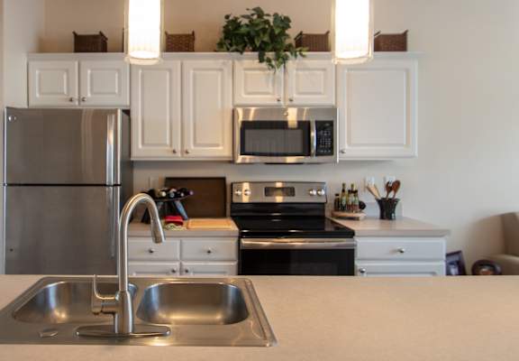 This is a photo of the kitchen in the 1242 square foot, 2 bedroom Spinnaker floor plan at Nantucket Apartments in Loveland, OH.