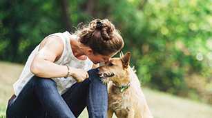 woman with her dog at park