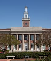 A large building with a tower and a clock on it.