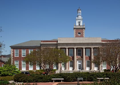 A large building with a tower and a clock on it.
