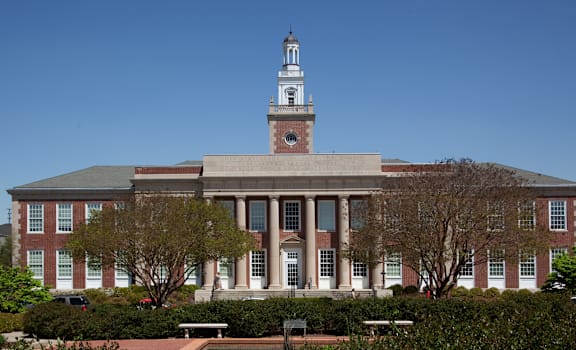 A large building with a tower and a clock on it.