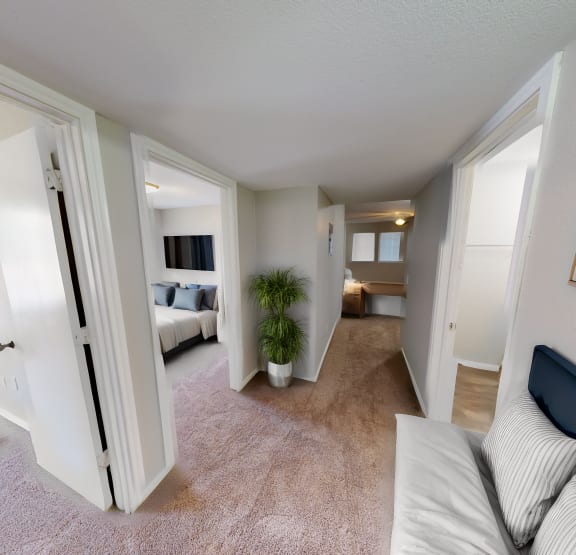 a bedroom with a bed and a ceiling fan