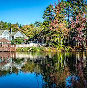Lake with reflection of house at Radbourne Lake Apartments, Charlotte, NC