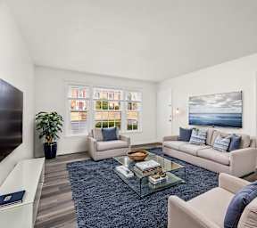 the master bedroom has a large bed and a tv