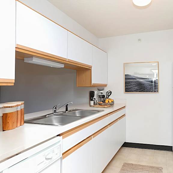 a bathroom with a sink and a toilet and a shower