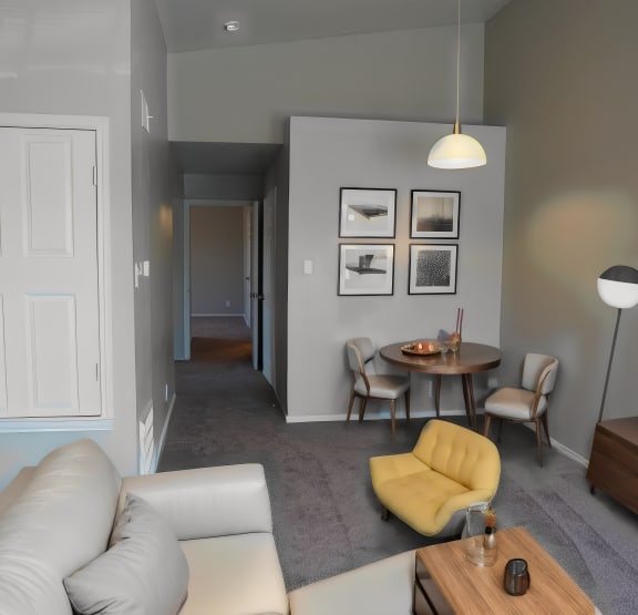a living room with a couch and a table and a television