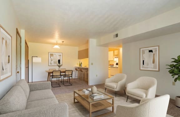 A living room with a couch, chair, and coffee table.