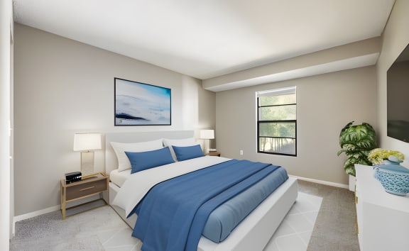 a bedroom with a white bed and blue pillows