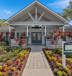 the entrance to a building with a sign in front of it at Oak Reserve at Winter Park, Florida, 32792