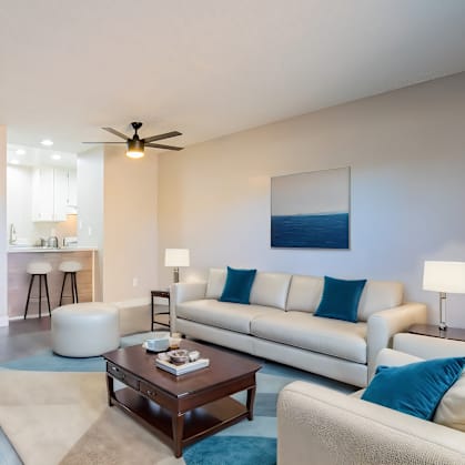 a living room with couches and a coffee table