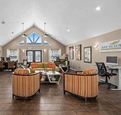 A room with a lot of furniture and a sign at Oak Reserve at Winter Park, Winter Park