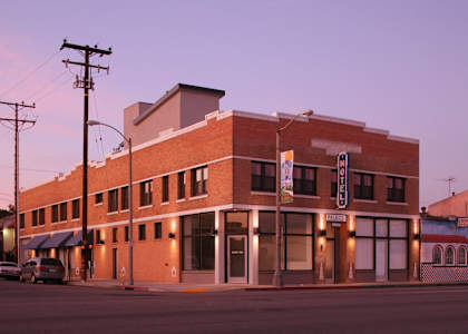 a large brick building on the corner of a street