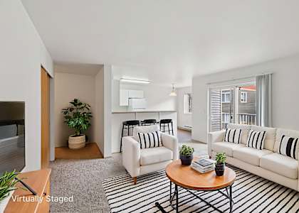 A living room with a white couch and a coffee table  at THE TIMBERS BY VINTAGE, Arlington, WA 98223