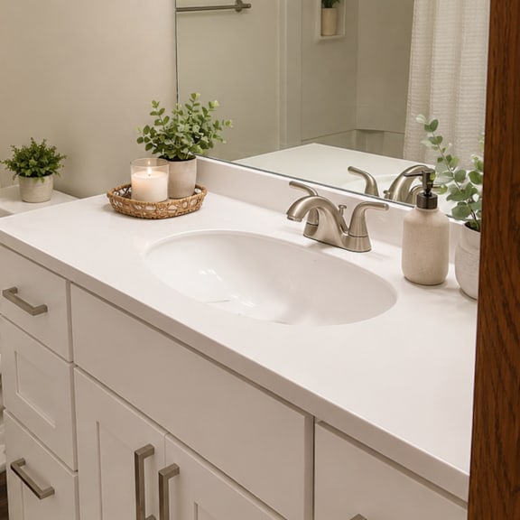a bathroom with a sink and a toilet and a shower