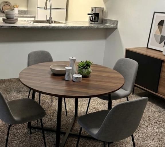 a living room with a couch and a table and a television