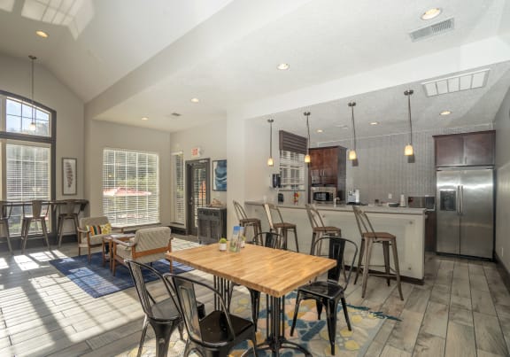 a dining room and kitchen with a table and chairs at Radbourne Lake Apartments, Charlotte, NC 28269